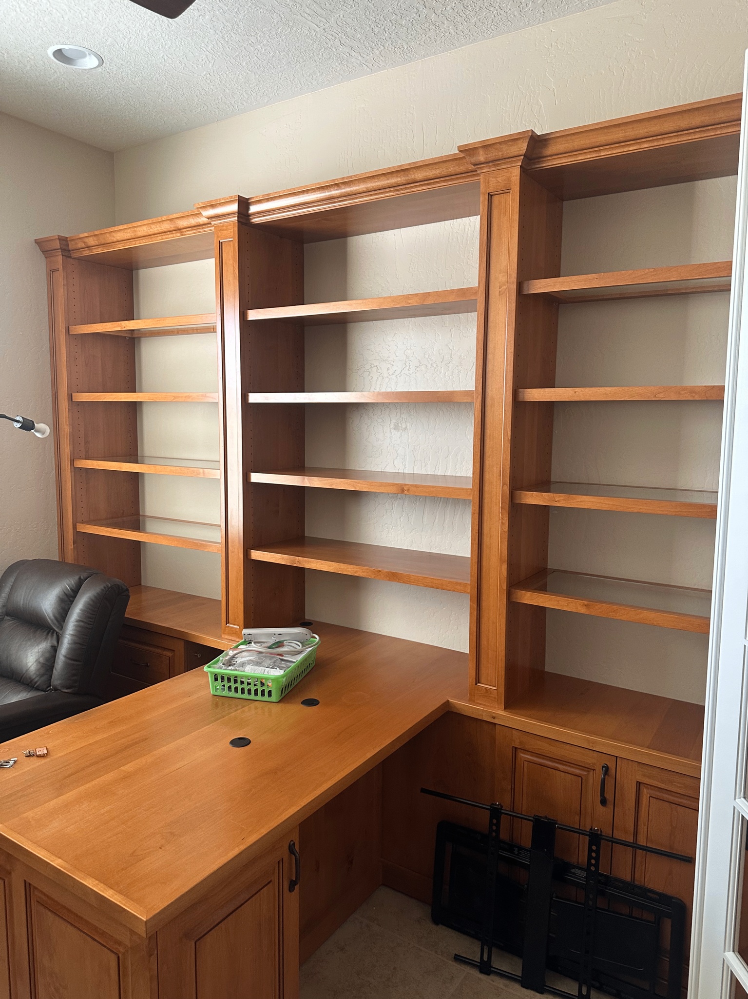 Built-in office desk and shelving system assembled
