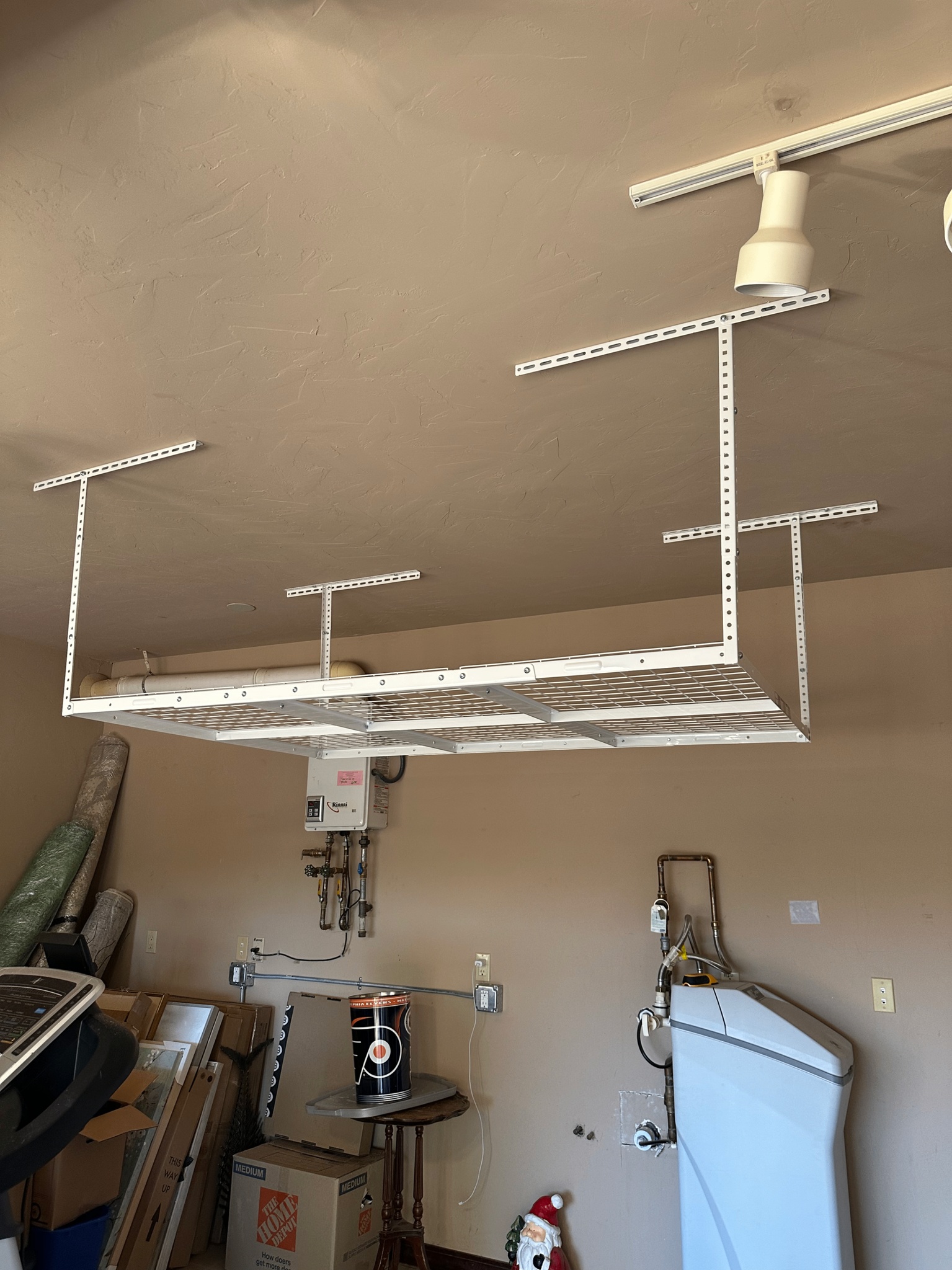 Overhead garage ceiling storage rack installed