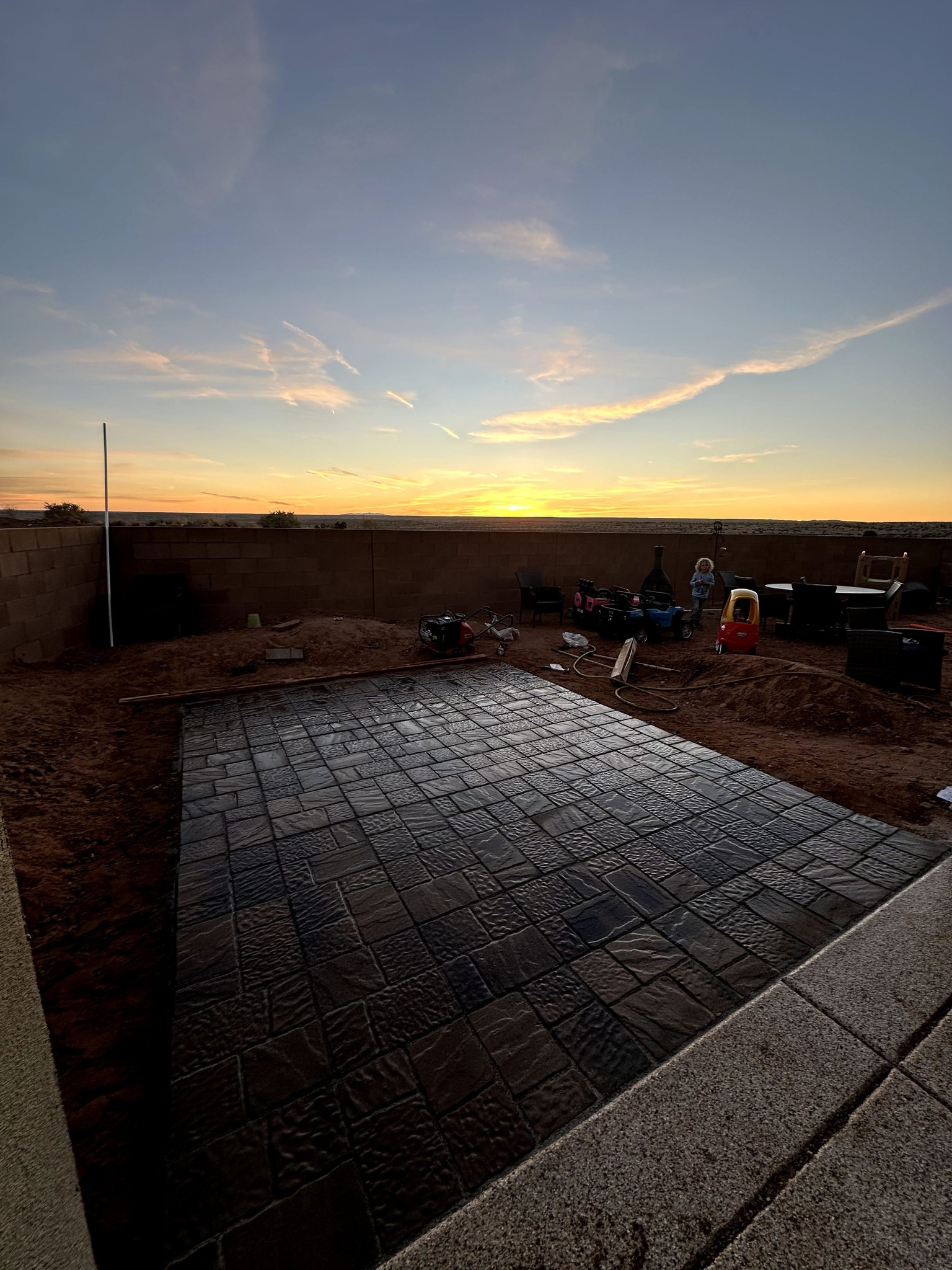 Stamped concrete patio installed at sunset in Albuquerque