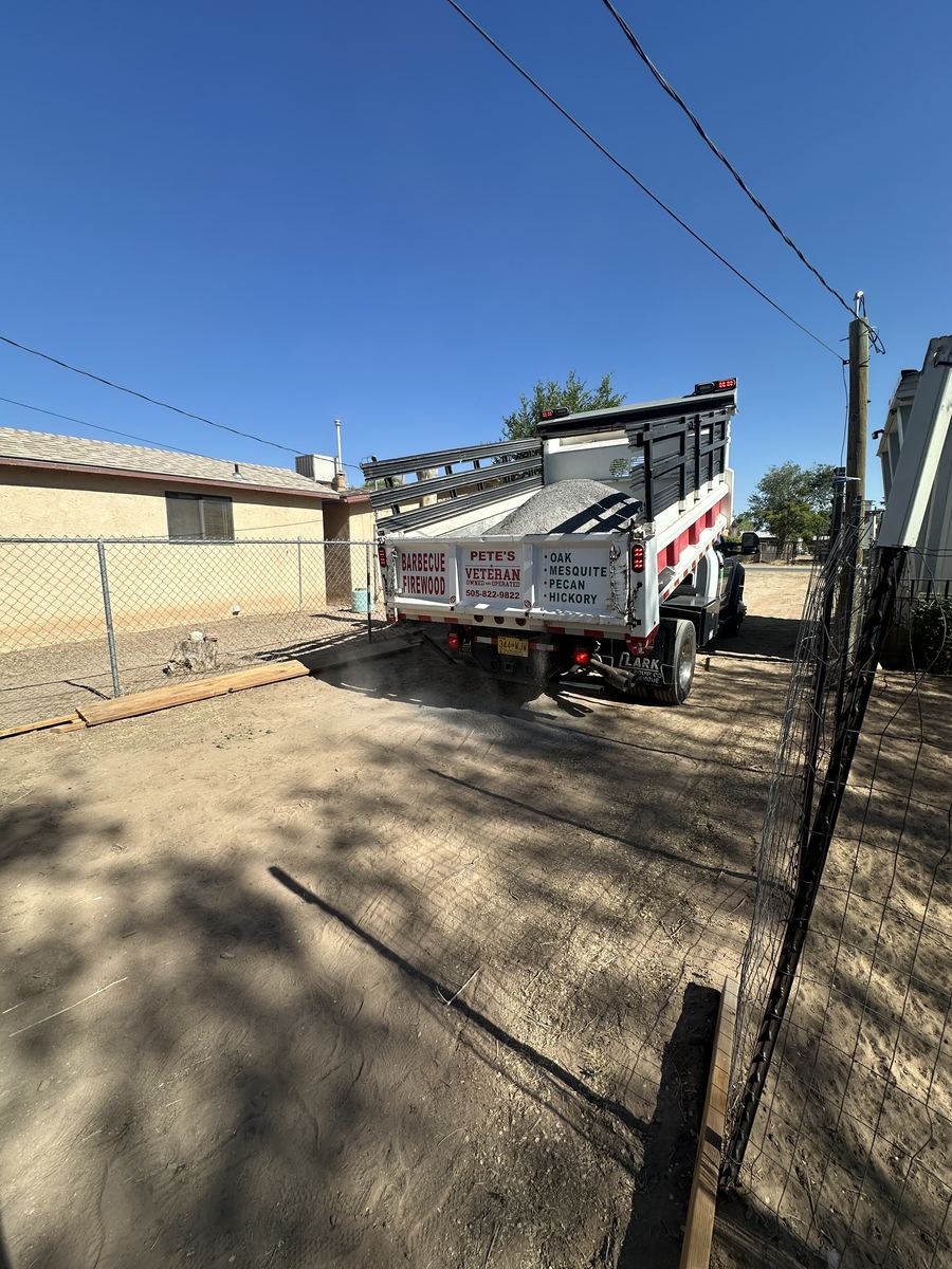 Base material delivery for a backyard pad project in Albuquerque
