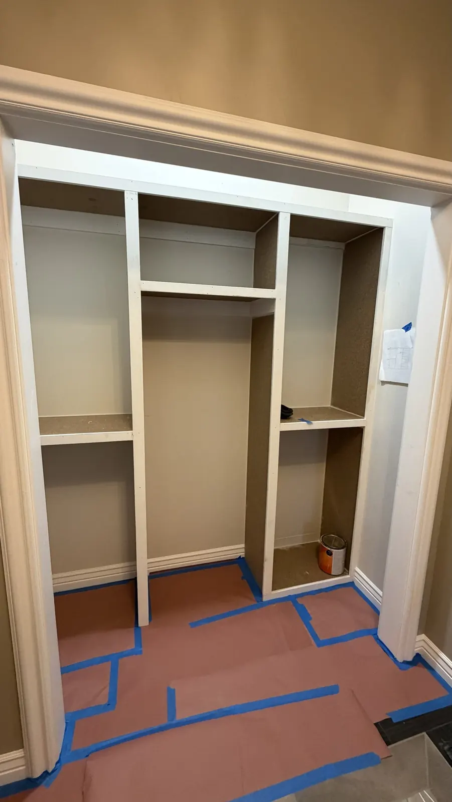 Custom closet built-in with shelving towers and hanging space