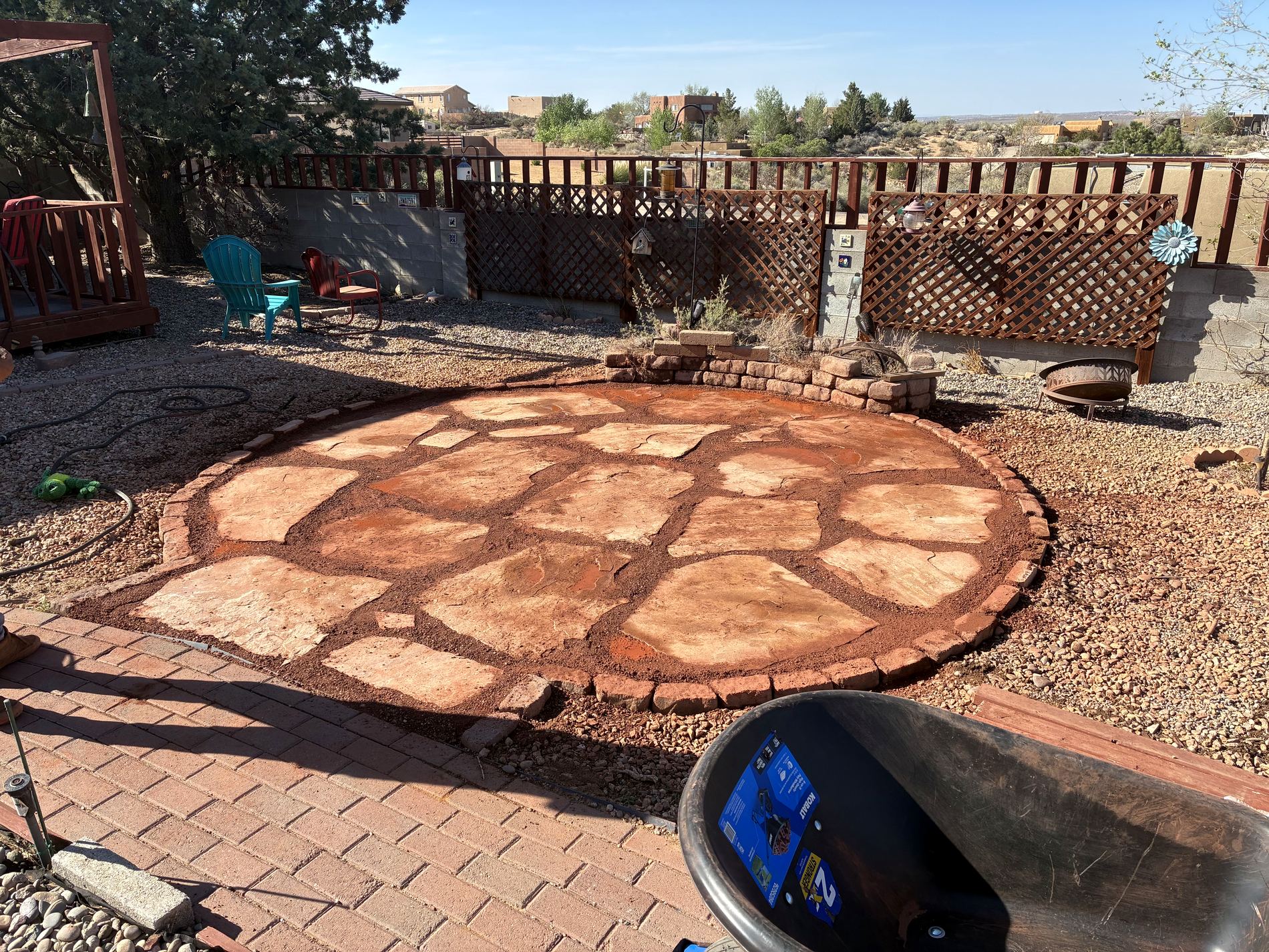 Flagstone patio with seat wall and gravel yard