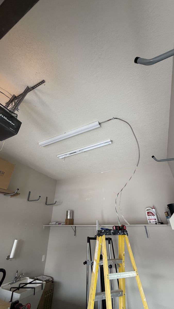 Garage LED light fixtures during installation