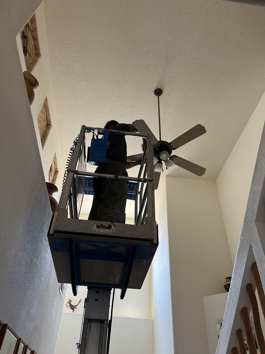 Ceiling fan install by scissor lift