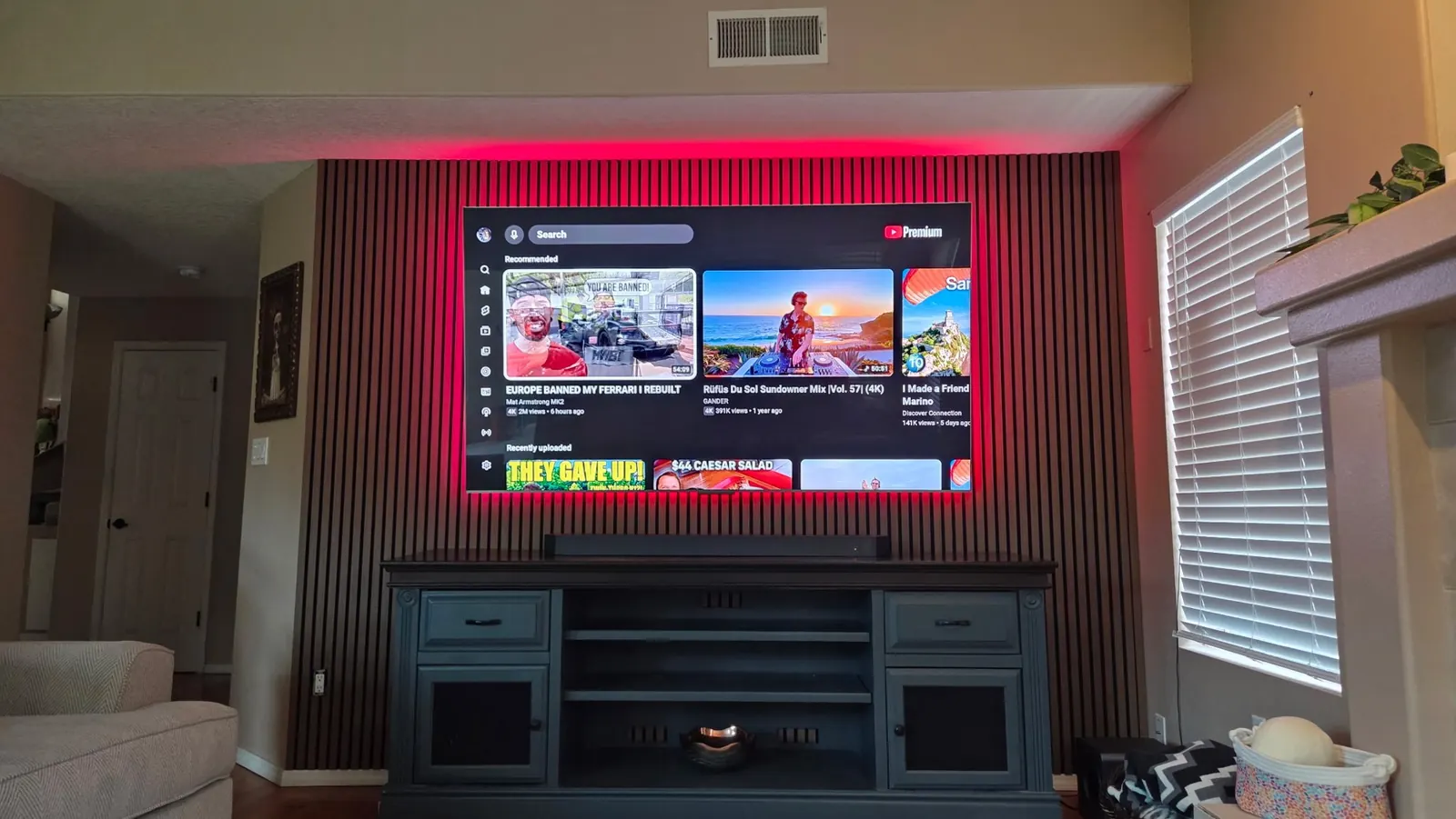 Slat wall TV mount with red LED backlighting