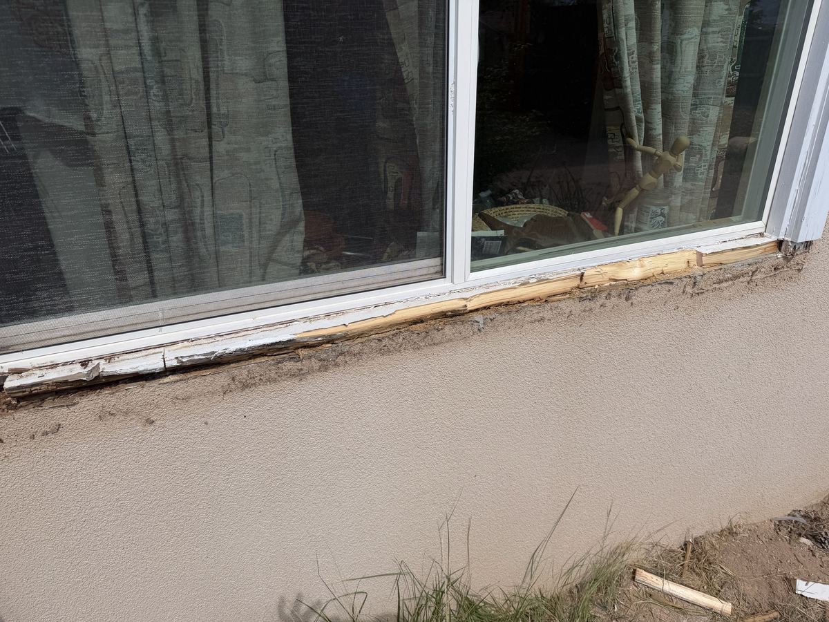 Rotted wood removed from window frame during restoration