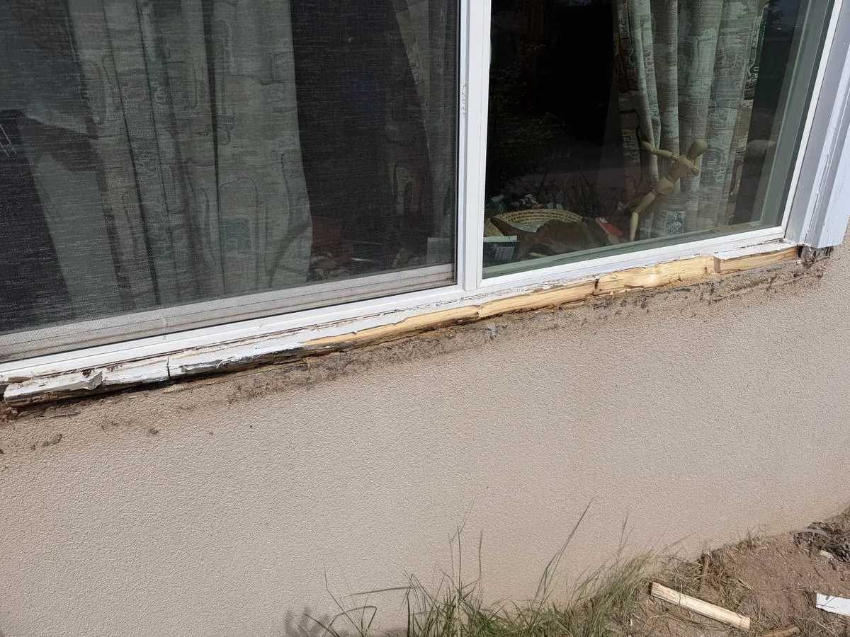 Rotted wood removed from window frame during restoration